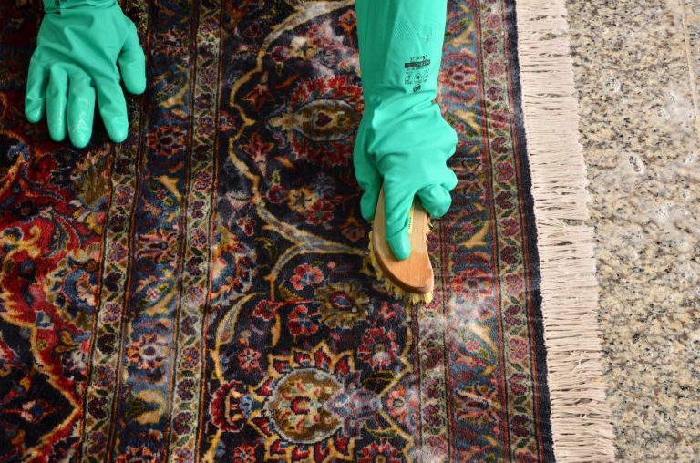 How can you clean an area rug so that it looks as good as new?